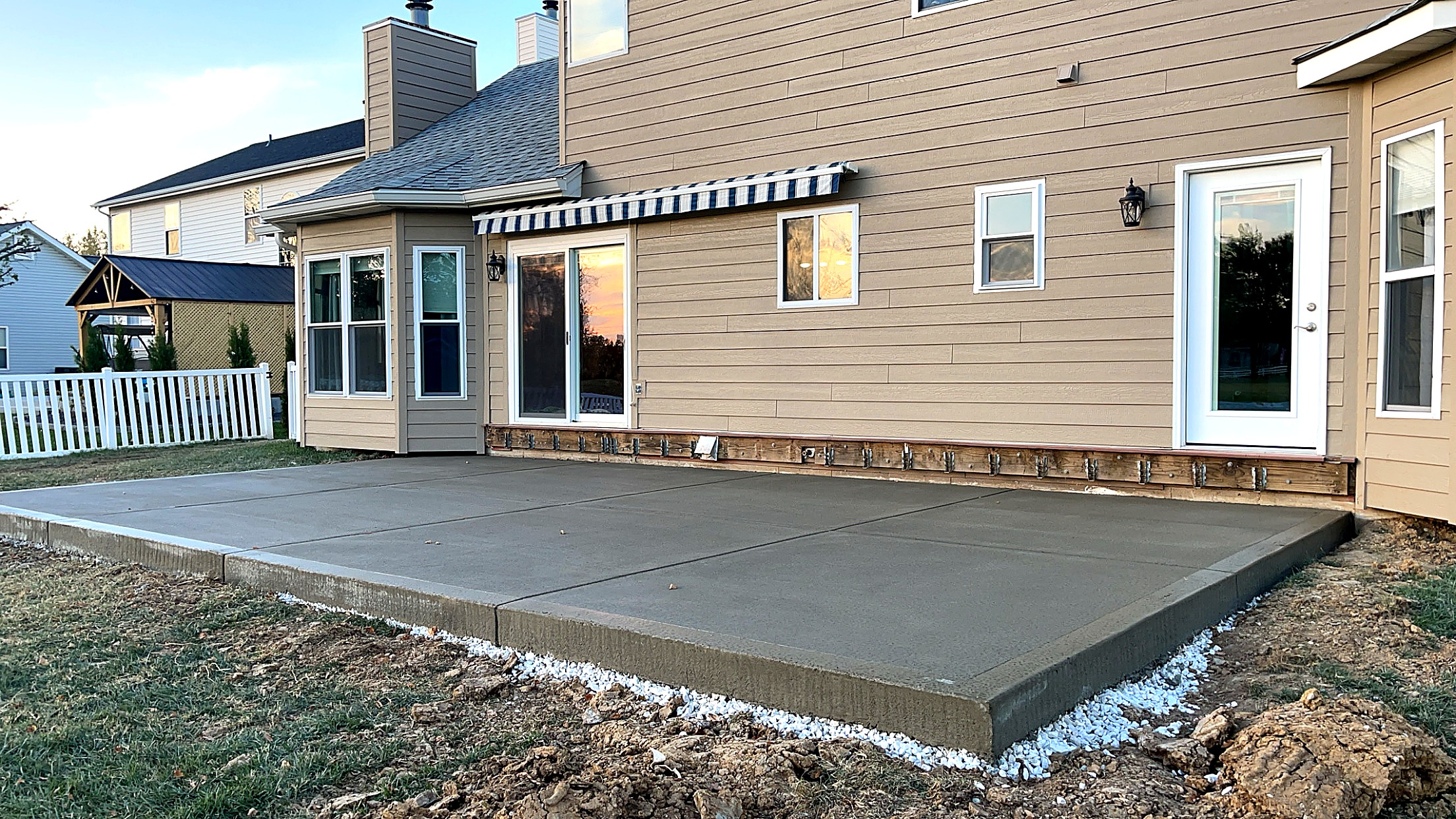 True Form Concrete patio installation at dusk — St. Charles County, MO